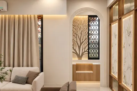 Arched alcove, Gulmohar House. A carved tree in relief behind an arch, a jaali of interlocking rings, and backlit panels painted with grasses.