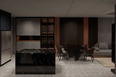 Island and bar, Smoke & Copper. A waterfall island in black marble, a lit glass bar cabinet, and stone-grey tall units.